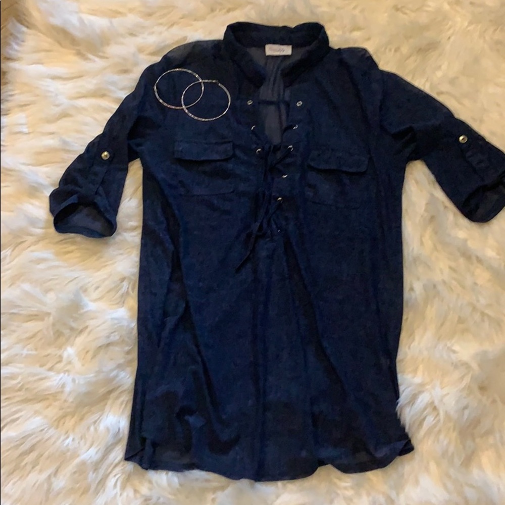 Casual tie front, blue shirt with silver accents.